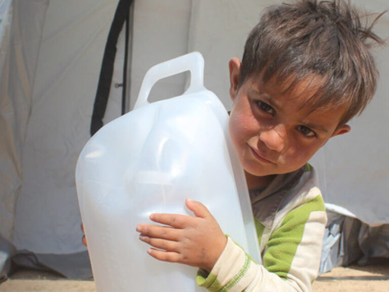 A child with a water carrier.