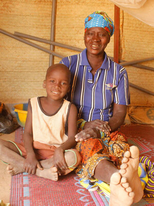 Mother and child sat on the floor