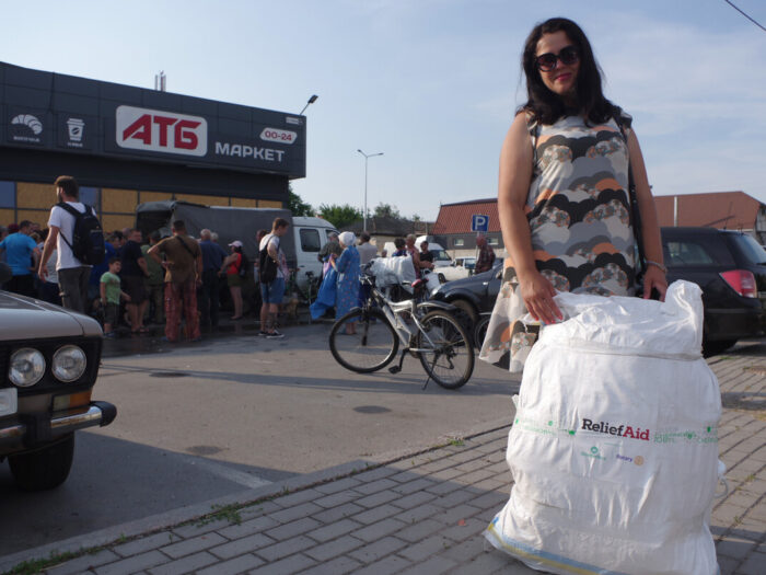 Woman with a bag of aid in Ukraine