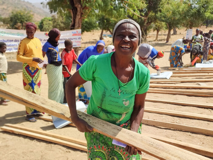 Woman collecting aid materials in Cameroon